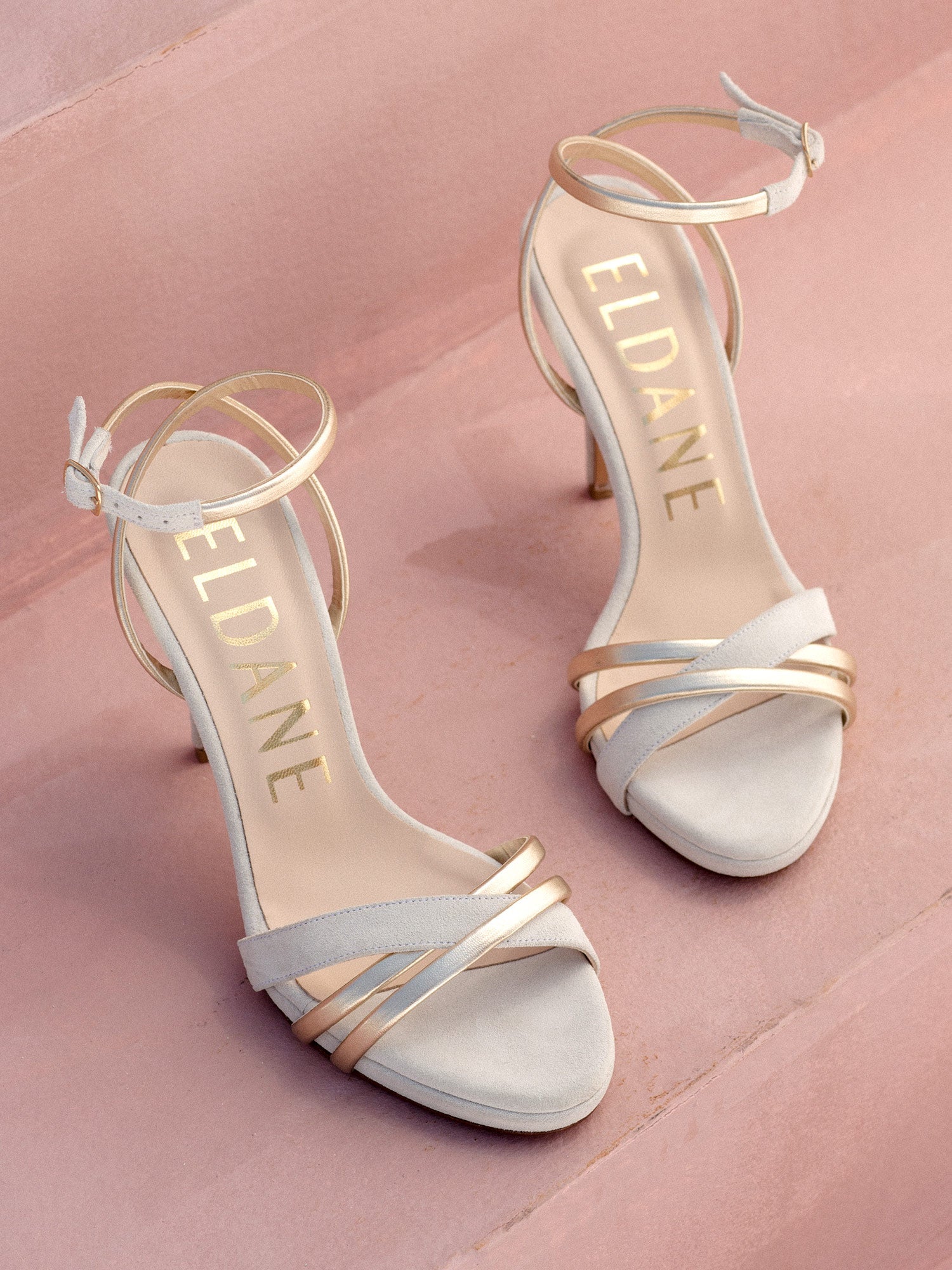 Heeled leather sandals in white and gold