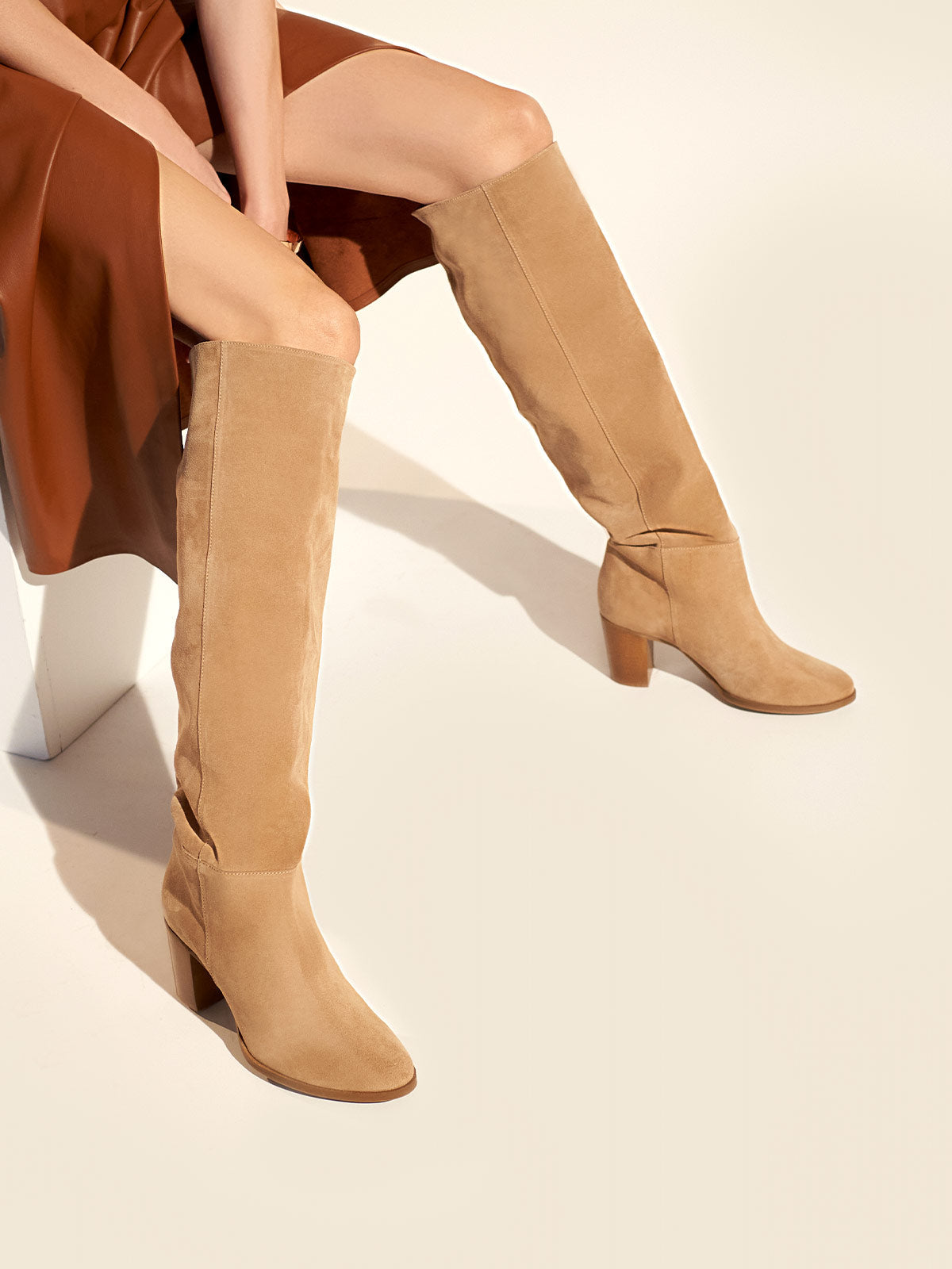 Block heel leather boots in beige