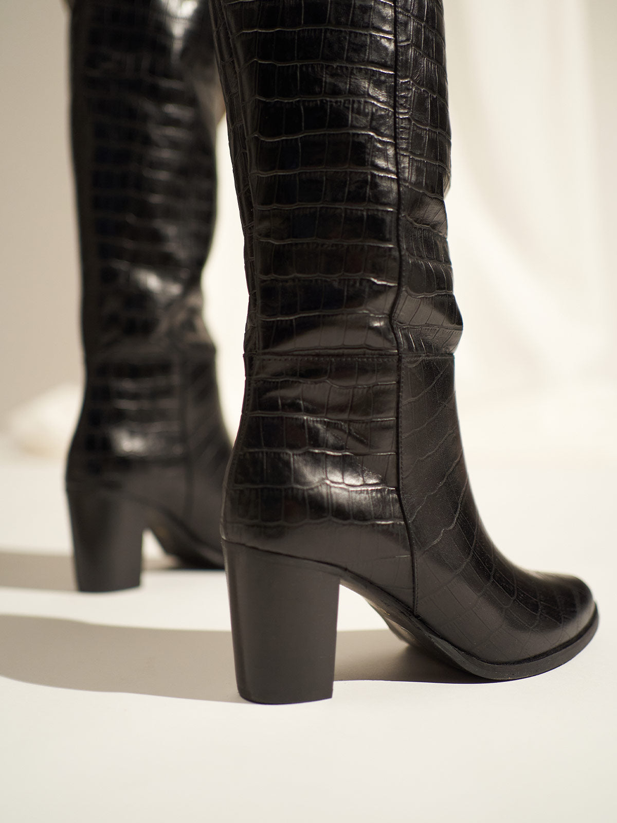 Block heel leather boots in black croco